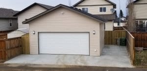 beige house and paved driveway in red deer