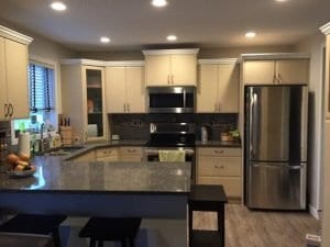house kitchen in red deer granite countertop silver fridge